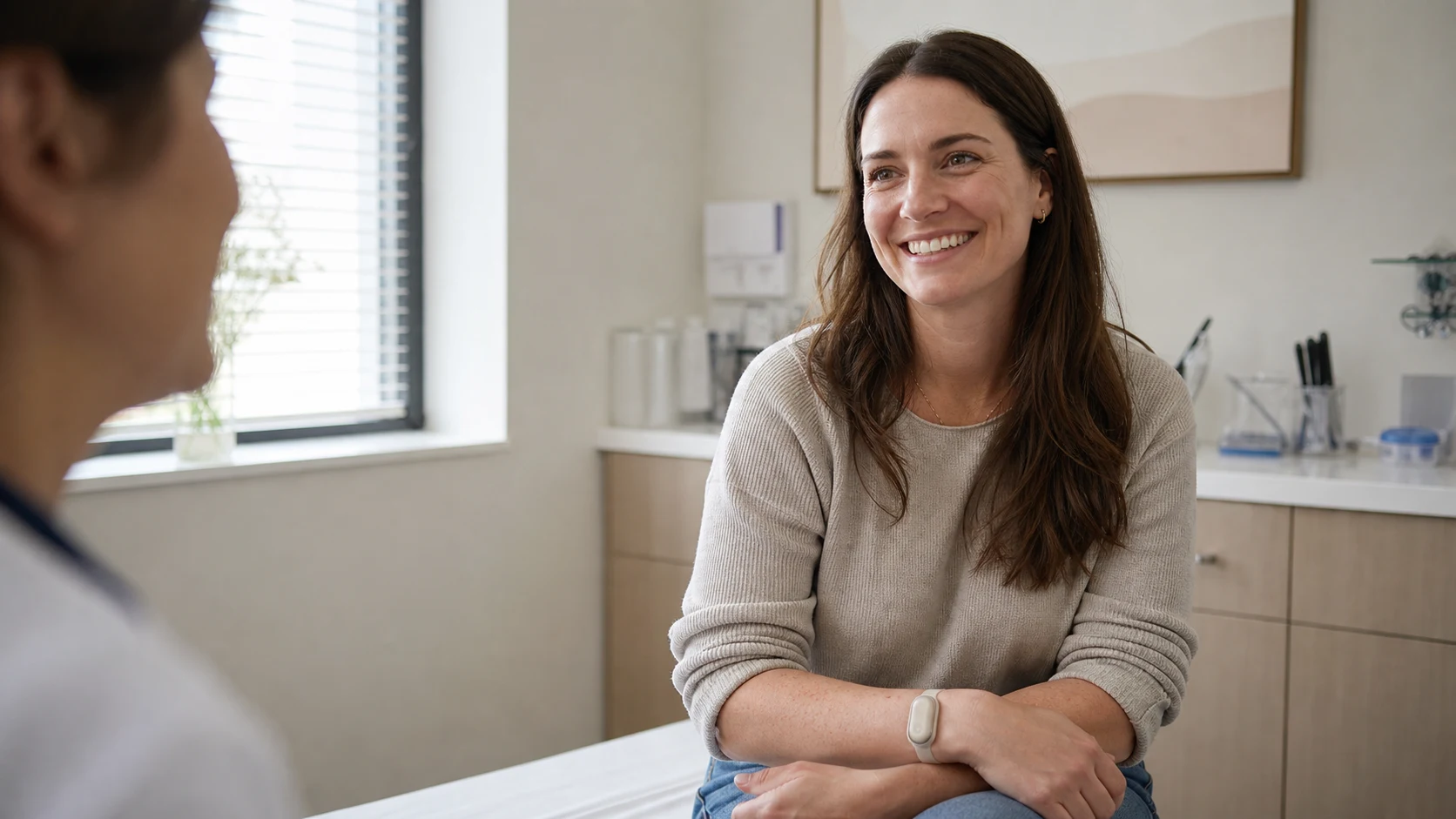 A woman smiles during a Shiora digital health consultation
